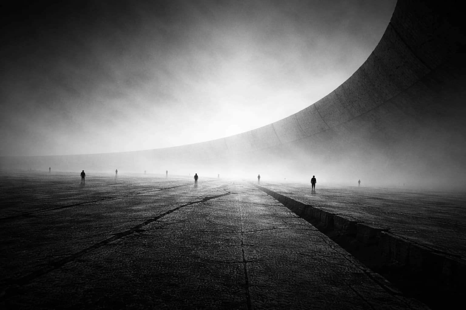 A monolithic ring structure emerging from dense fog